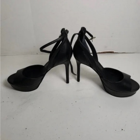 Chic black peep-toe heels by Guess. Sleek design with ankle strap.Brand New - Picture 2 of 5